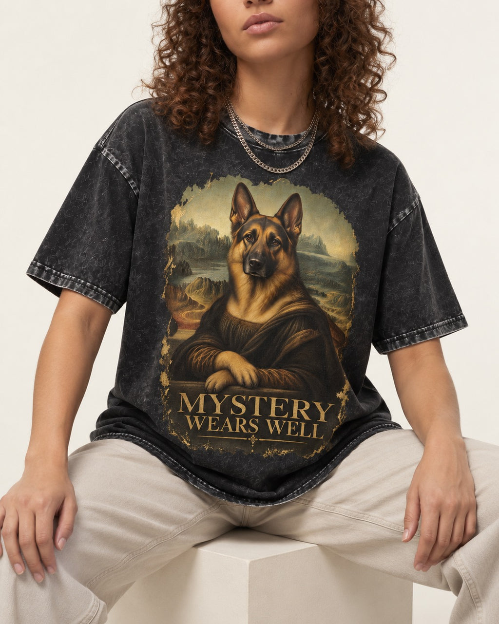 German Shepherd Dog Mystery Wears Well Renaissance Portrait Washed Tee in Black, worn by a seated model