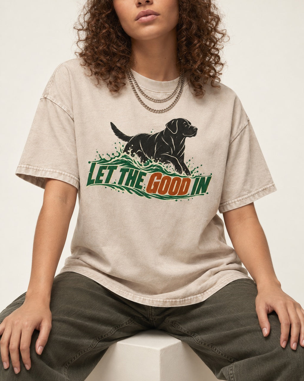 Labrador Retriever Let the Good In Washed Tee in Apricot, worn by a seated model