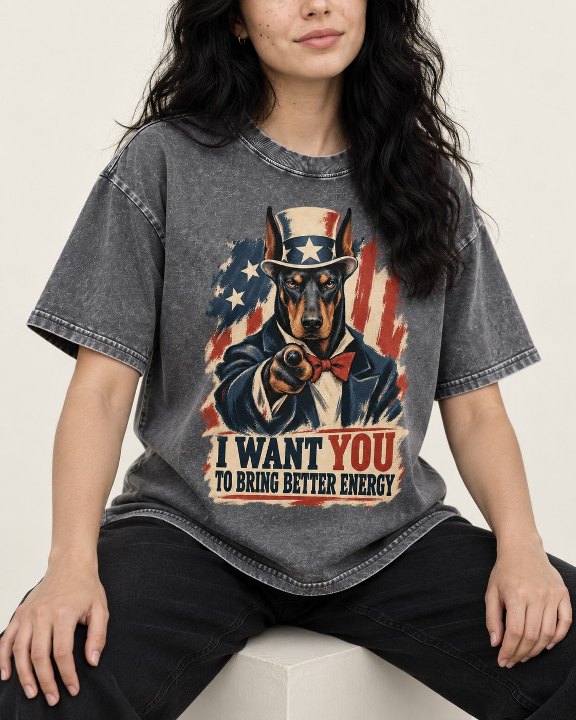 Doberman I Want You to Bring Better Energy Uncle Sam Graphic Washed Tee in Gray, worn by a seated model