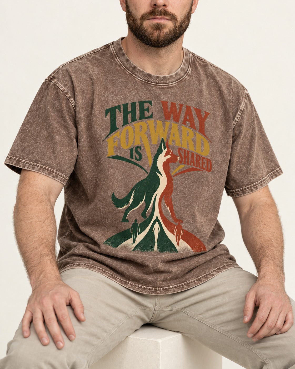 Shared Way Forward German Shepherd Dog Washed Tee in Coffee, worn by a seated model