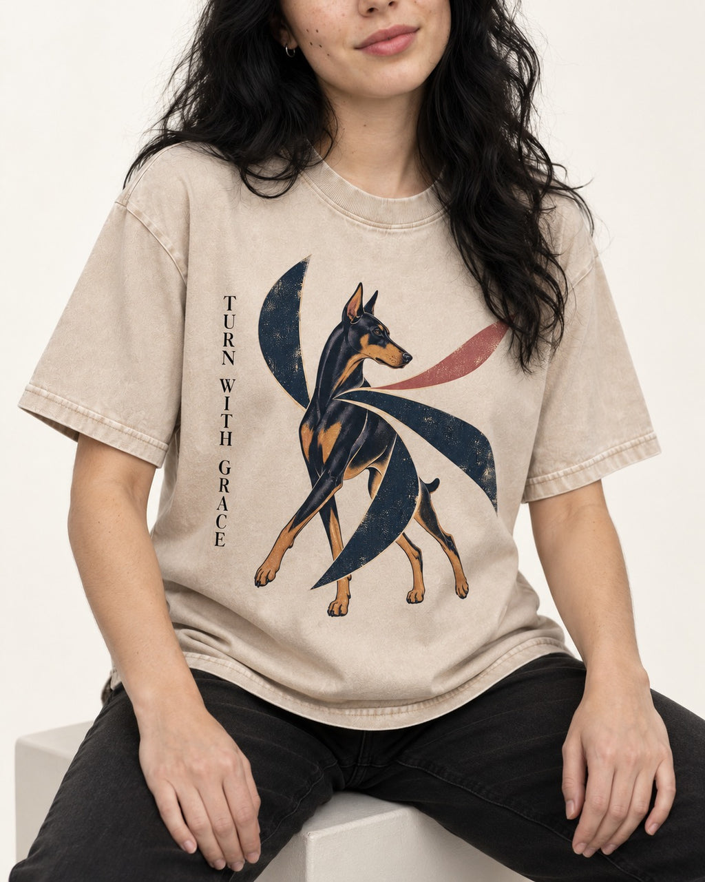Turn with Doberman Grace Washed Tee in Apricot, worn by a seated model