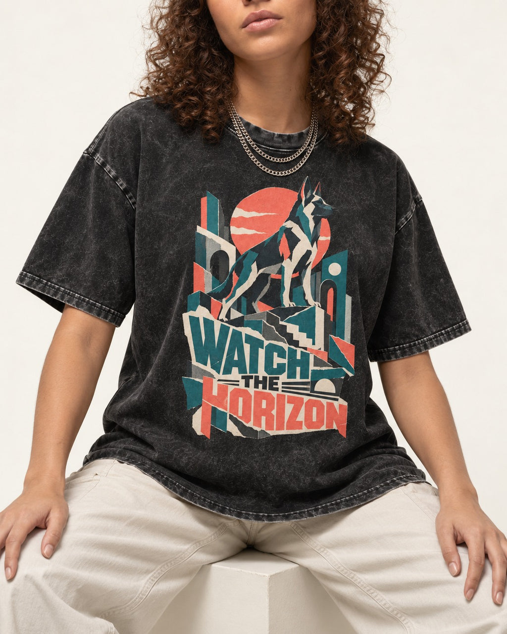 Watch The Horizon Cut Paper Cityscape German Shepherd Dog Graphic Washed Tee in Black, worn by a seated model