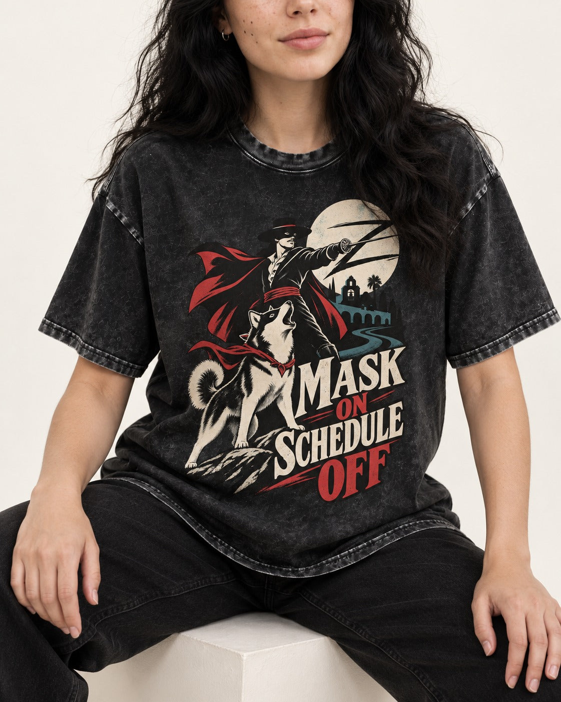 Husky Mask On Schedule Off Masked Swordsman Graphic Washed Tee in Black, worn by a seated model