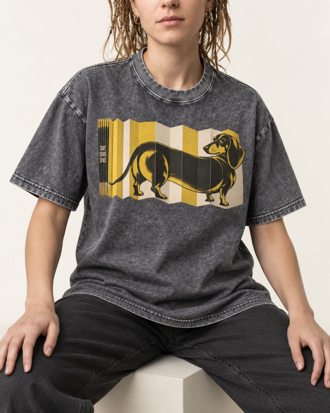 Dachshund Save Some Space Accordion Screen Graphic Washed Tee in Gray, worn by a seated model