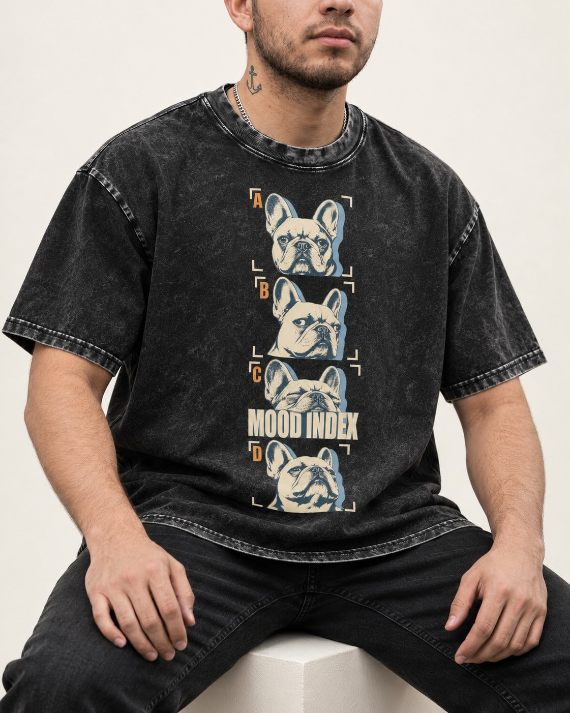 Frenchie Mood Index Four-Panel Strip Graphic Washed Tee in Black, worn by a seated model