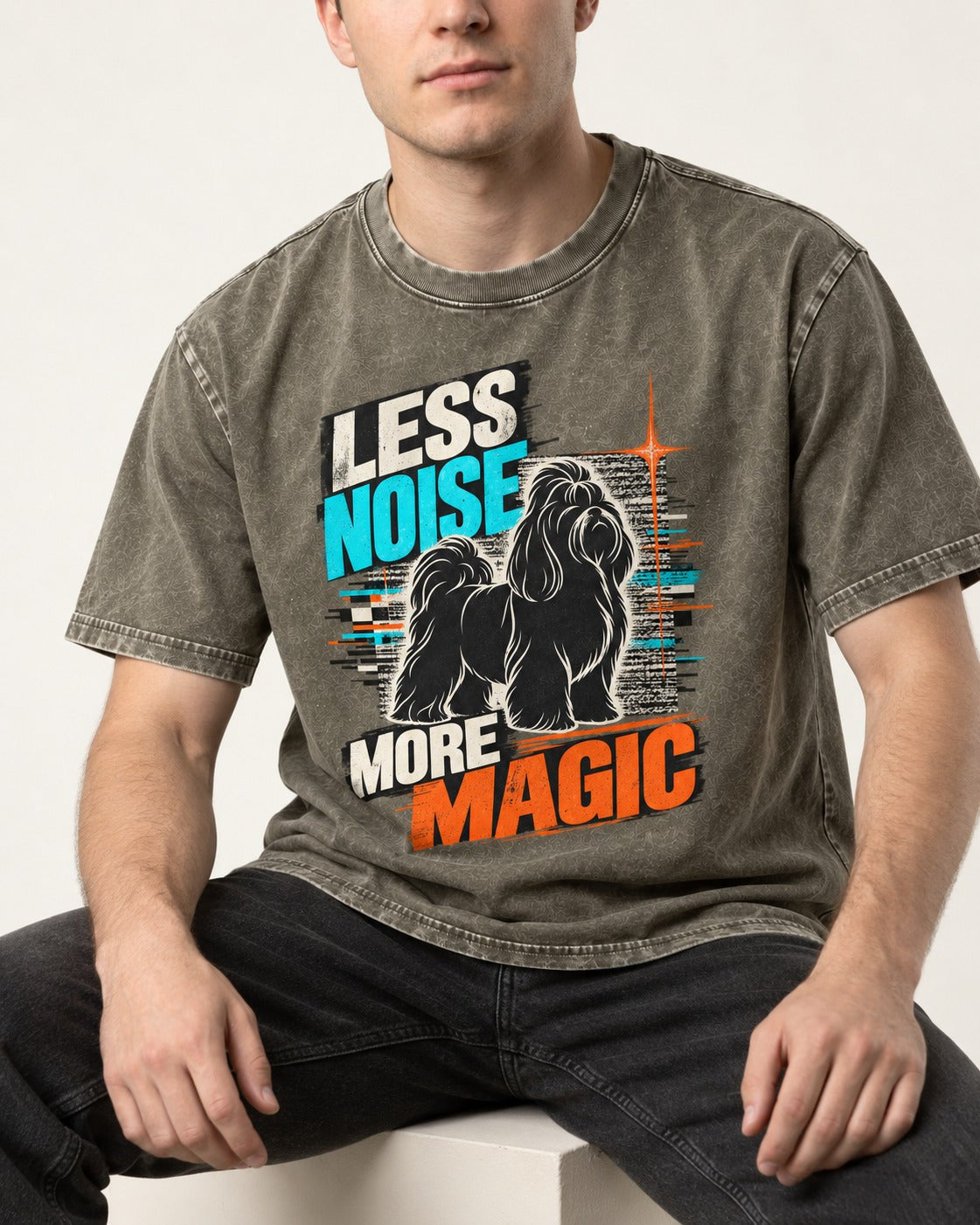 Shih Tzu Less Noise More Magic Pop Art Graphic Washed Tee in Army Green, worn by a seated model