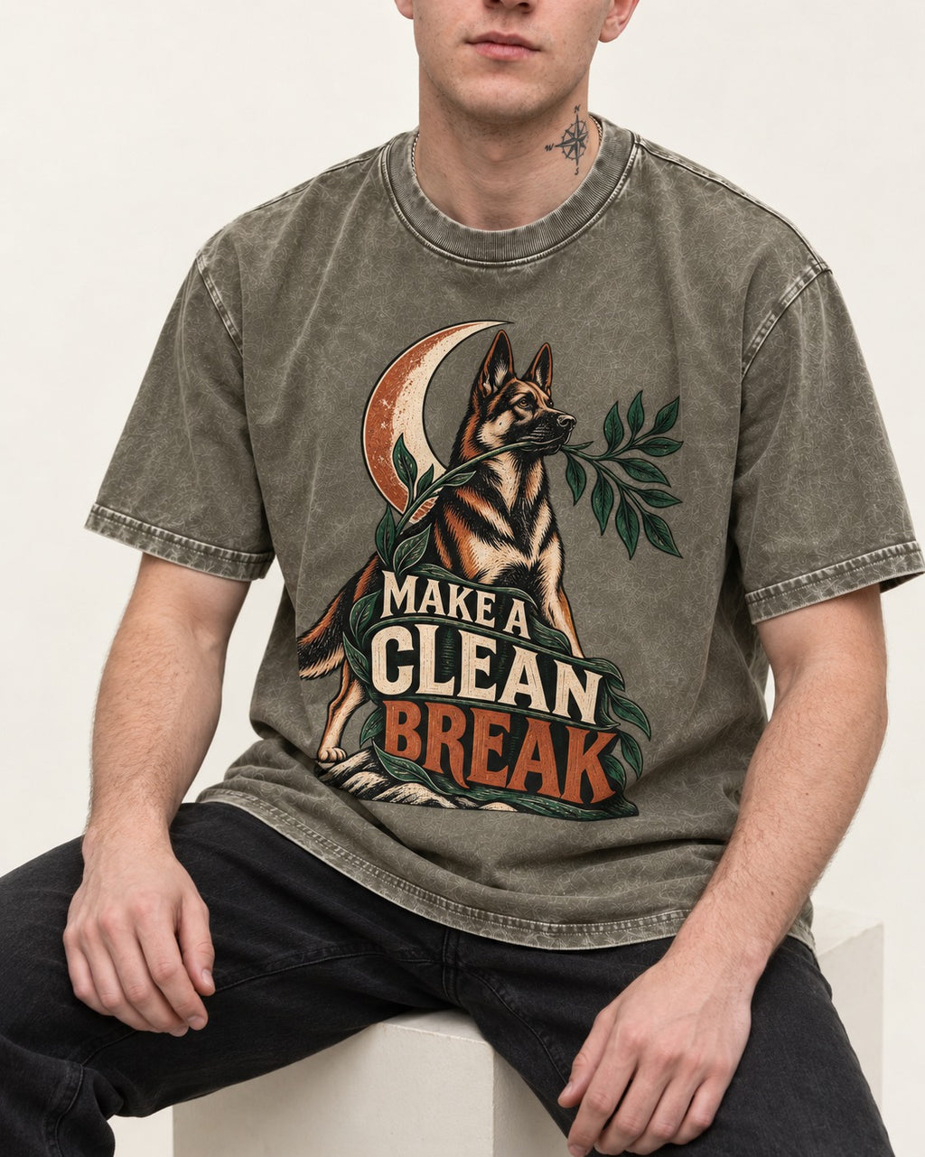 Make A Clean Break Crescent Botanical German Shepherd Dog Graphic Washed Tee in Army Green, worn by a seated model