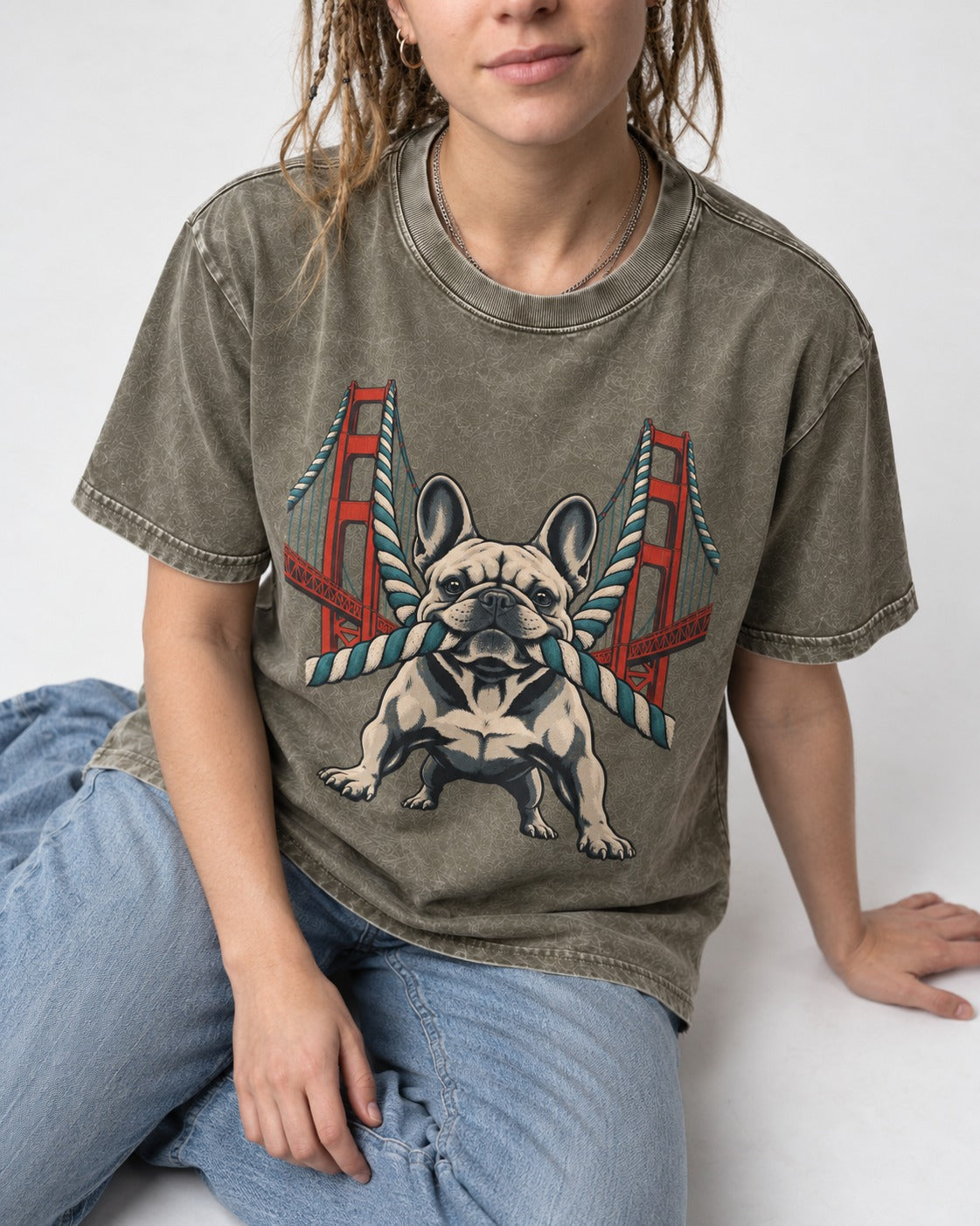 Frenchie Tug Anchor Bridge Graphic Washed Tee in Army Green, worn by a seated model