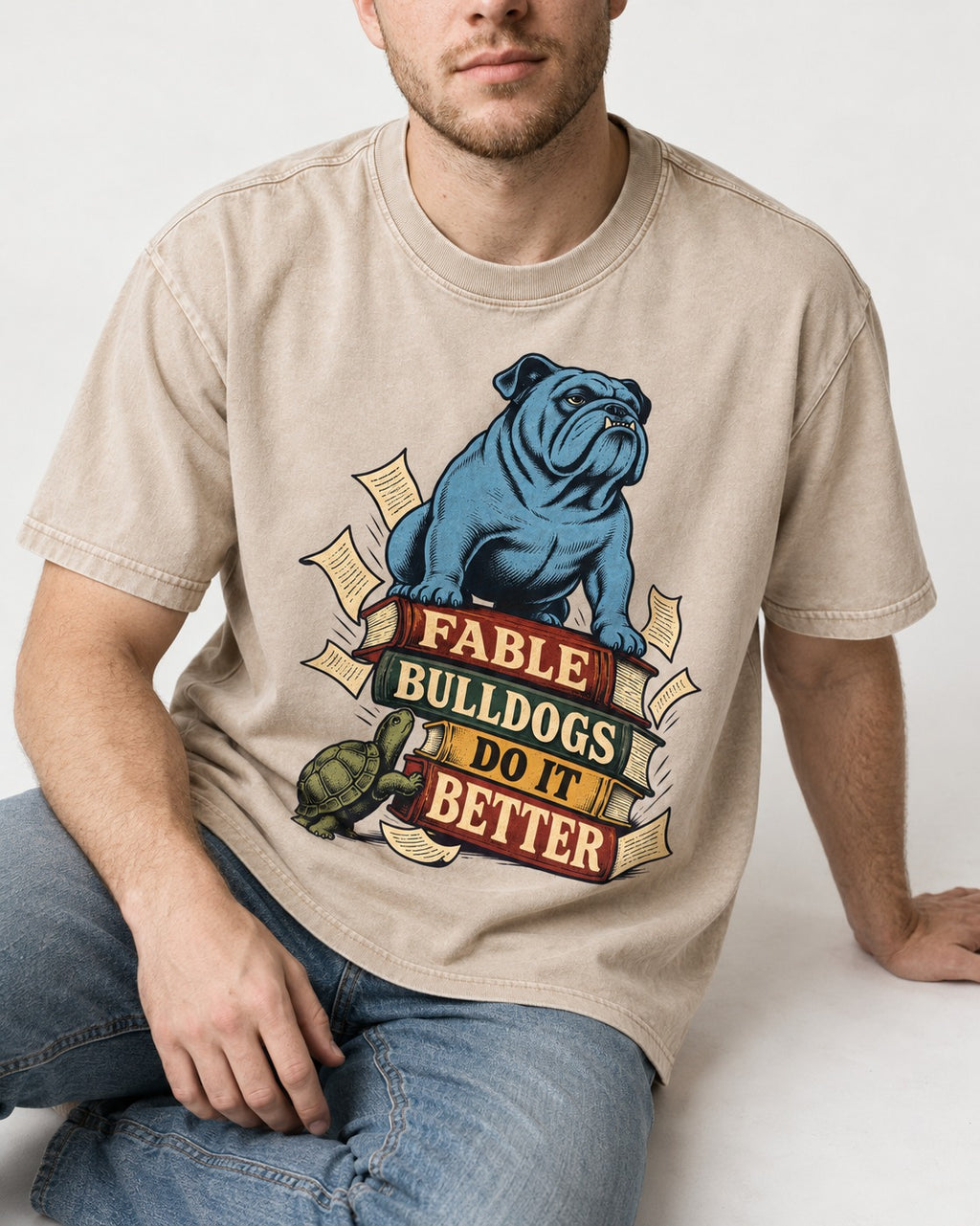 English Bulldog Does It Better Washed Tee in Apricot, worn by a seated model