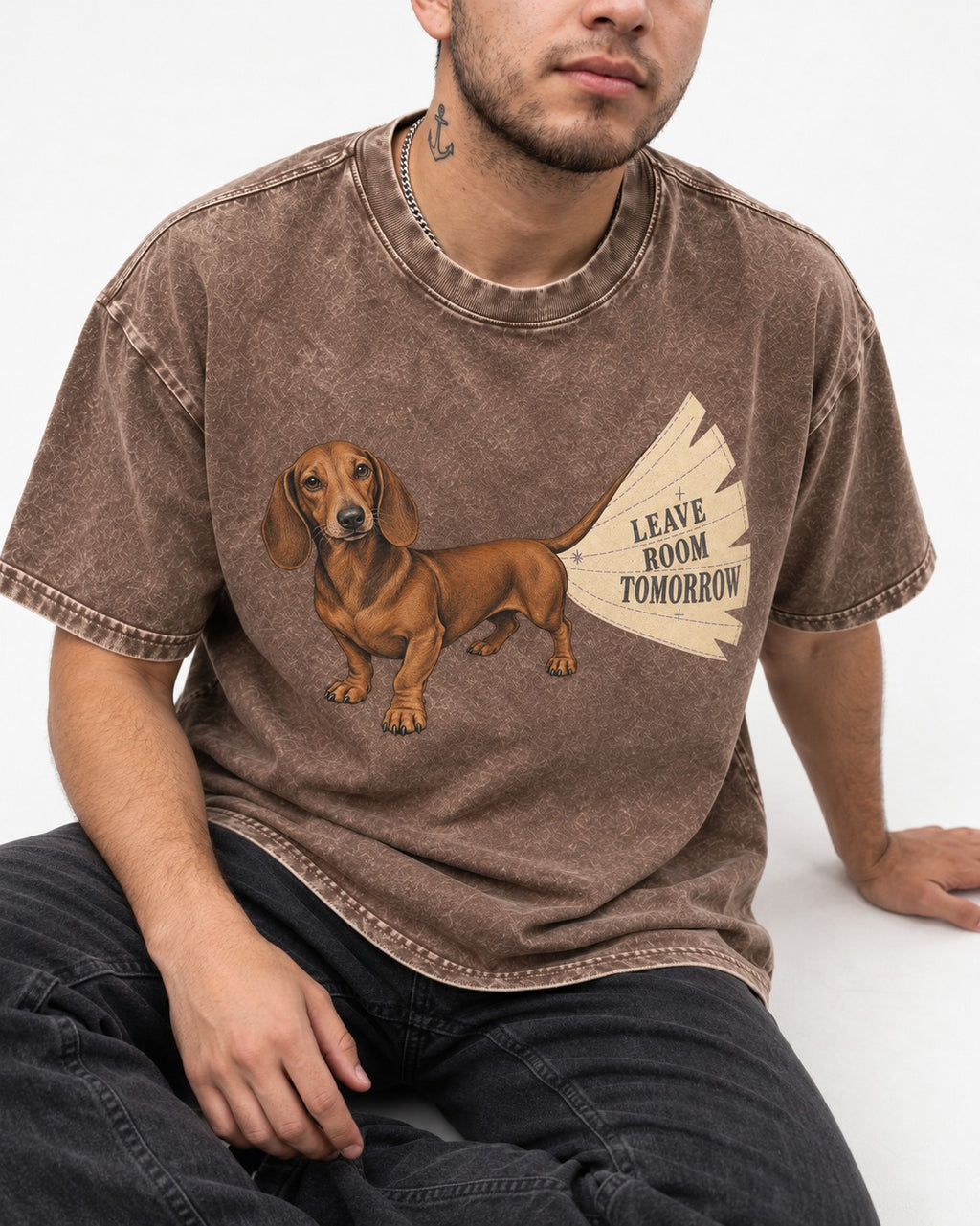 Dachshund Leave Room Tomorrow Washed Tee in Coffee, worn by a seated model