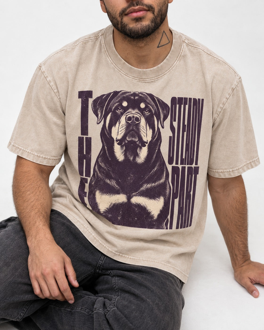 Rottweiler The Steady Part Washed Tee in Apricot, worn by a seated model