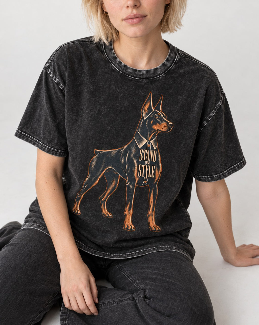 Doberman Stand in Style Suit Graphic Washed Tee in Black, worn by a seated model