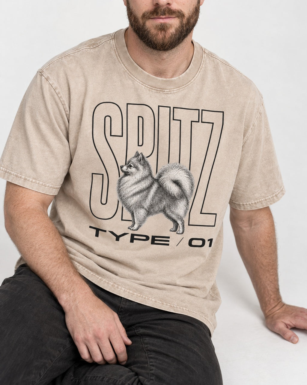 Pomeranian Spitz Washed Tee in Apricot, worn by a seated model