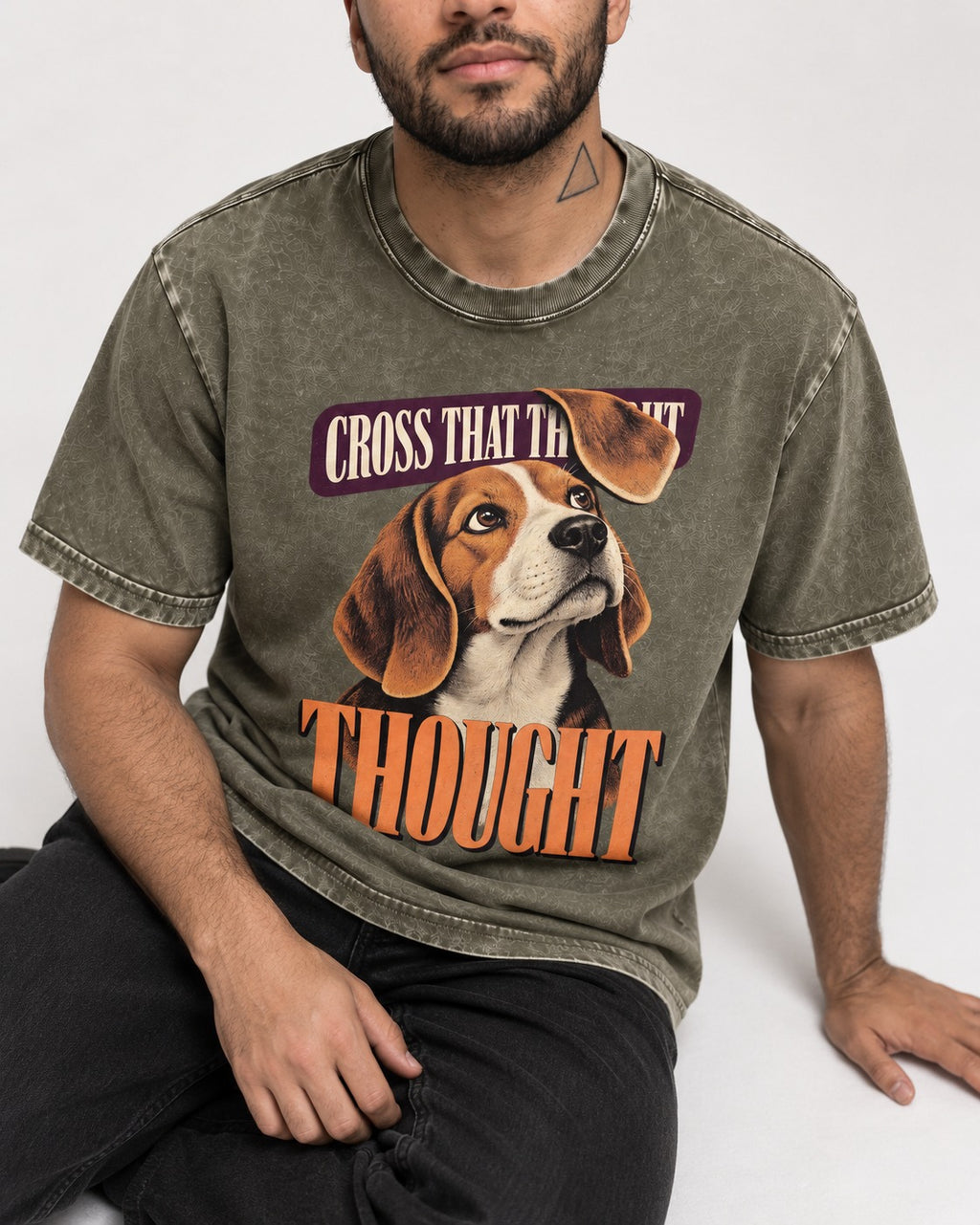 Cross That Beagle Thought Washed Tee in Army Green, worn by a seated model