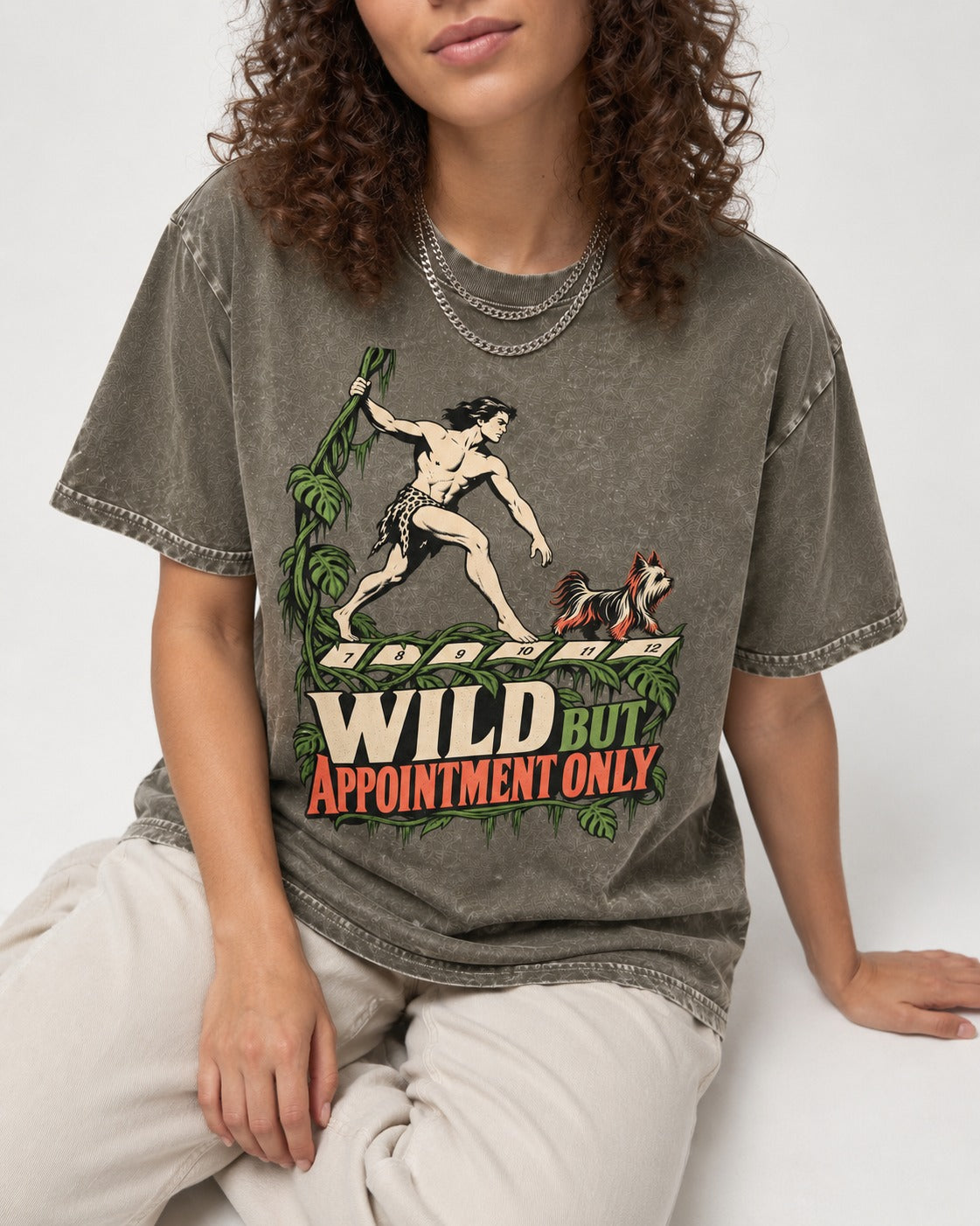 Yorkshire Terrier Wild but Appointment Only Jungle Calendar Graphic Washed Tee in Army Green, worn by a seated model