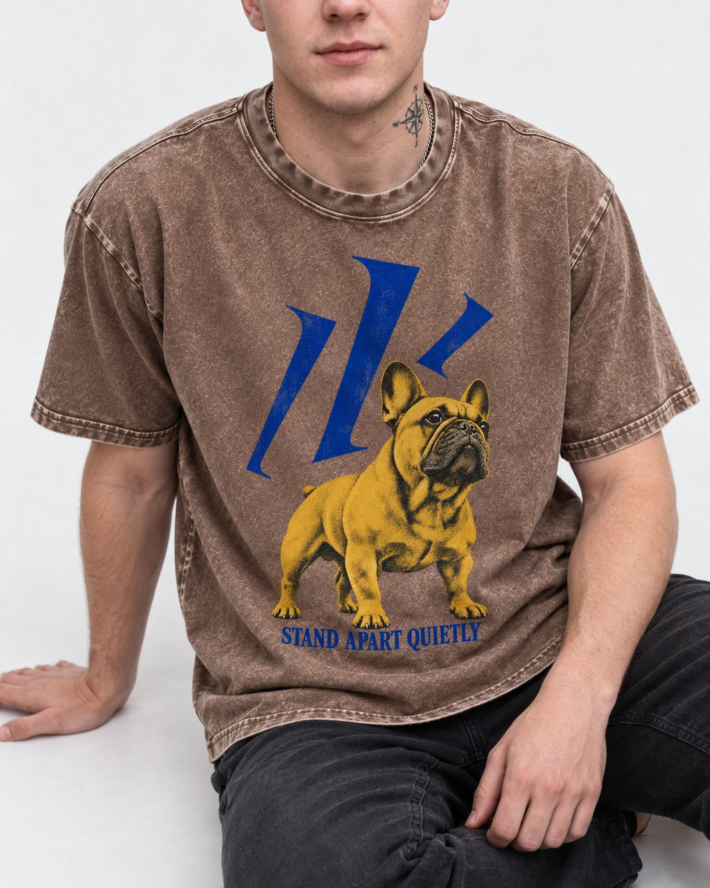 Frenchie Stand Apart Quietly Washed Tee in Coffee, worn by a seated model
