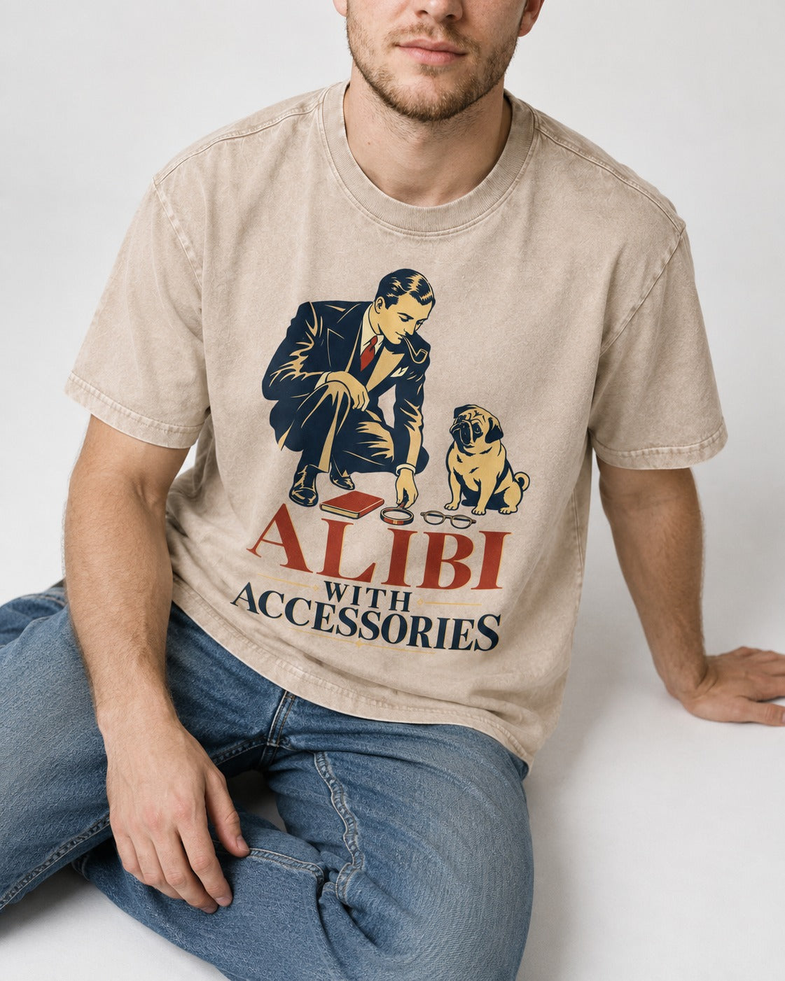 Pug Alibi with Accessories Washed Tee in Apricot, worn by a seated model