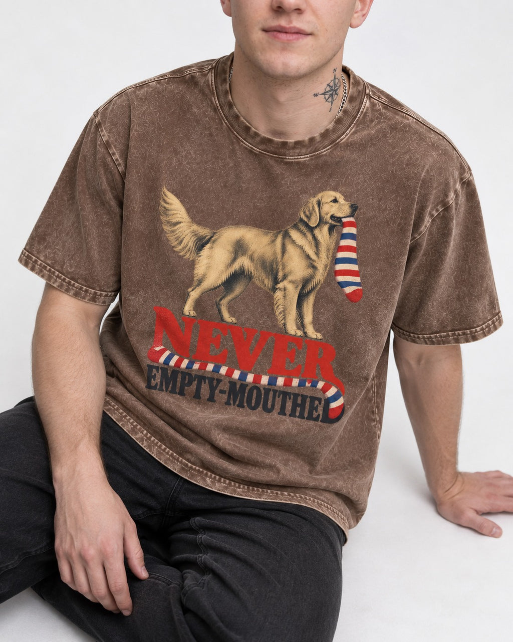 Never Empty Mouthed Golden Retriever Washed Tee in Coffee, worn by a seated model