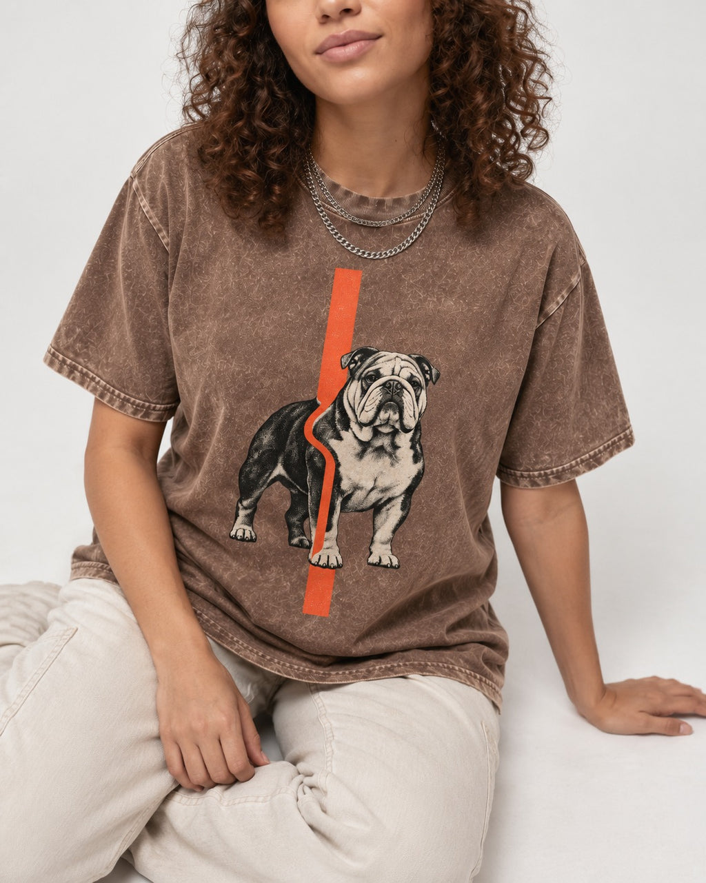English Bulldog Quiet Strength Washed Tee in Coffee, worn by a seated model