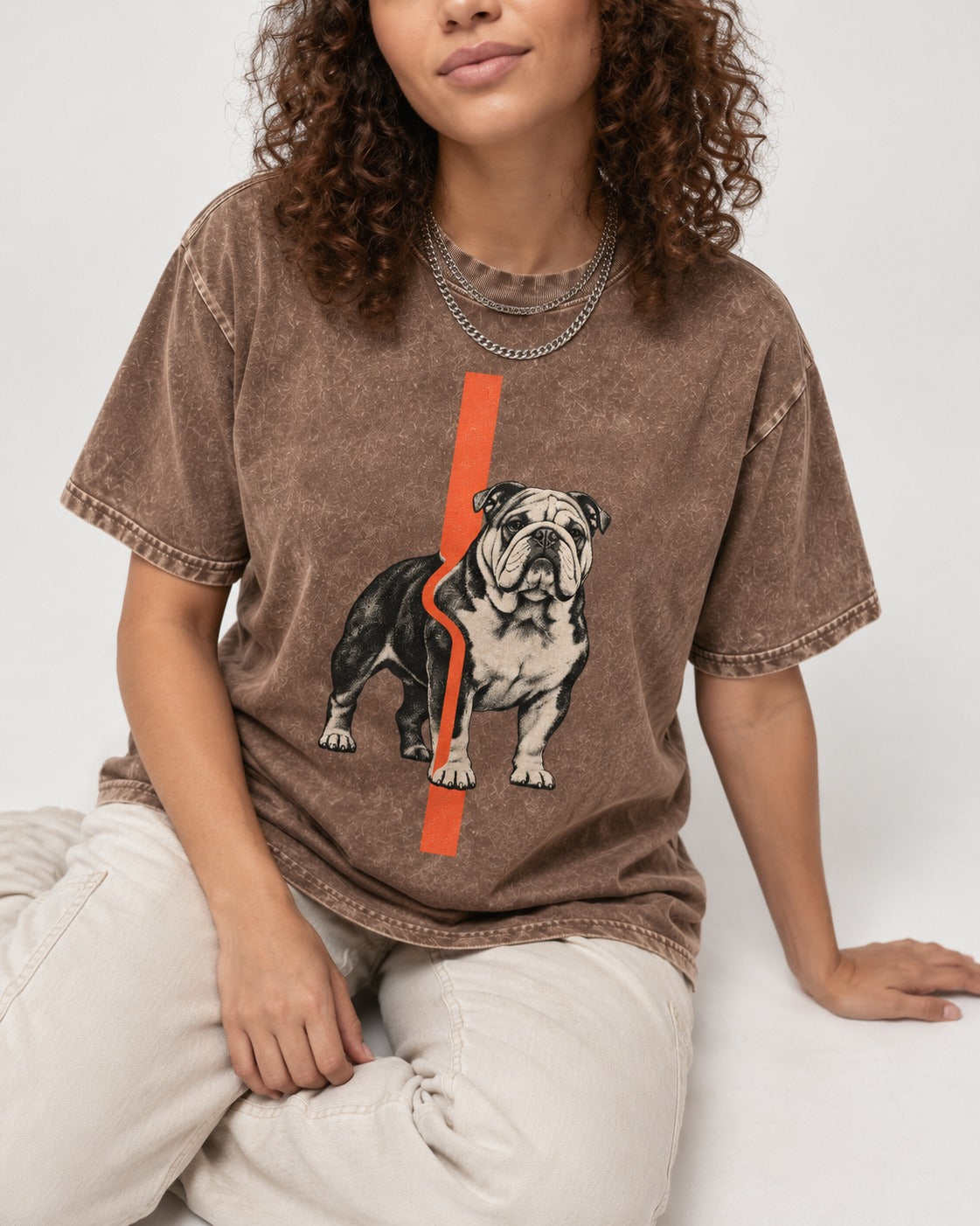 English Bulldog Quiet Strength Washed Tee in Coffee, worn by a seated model
