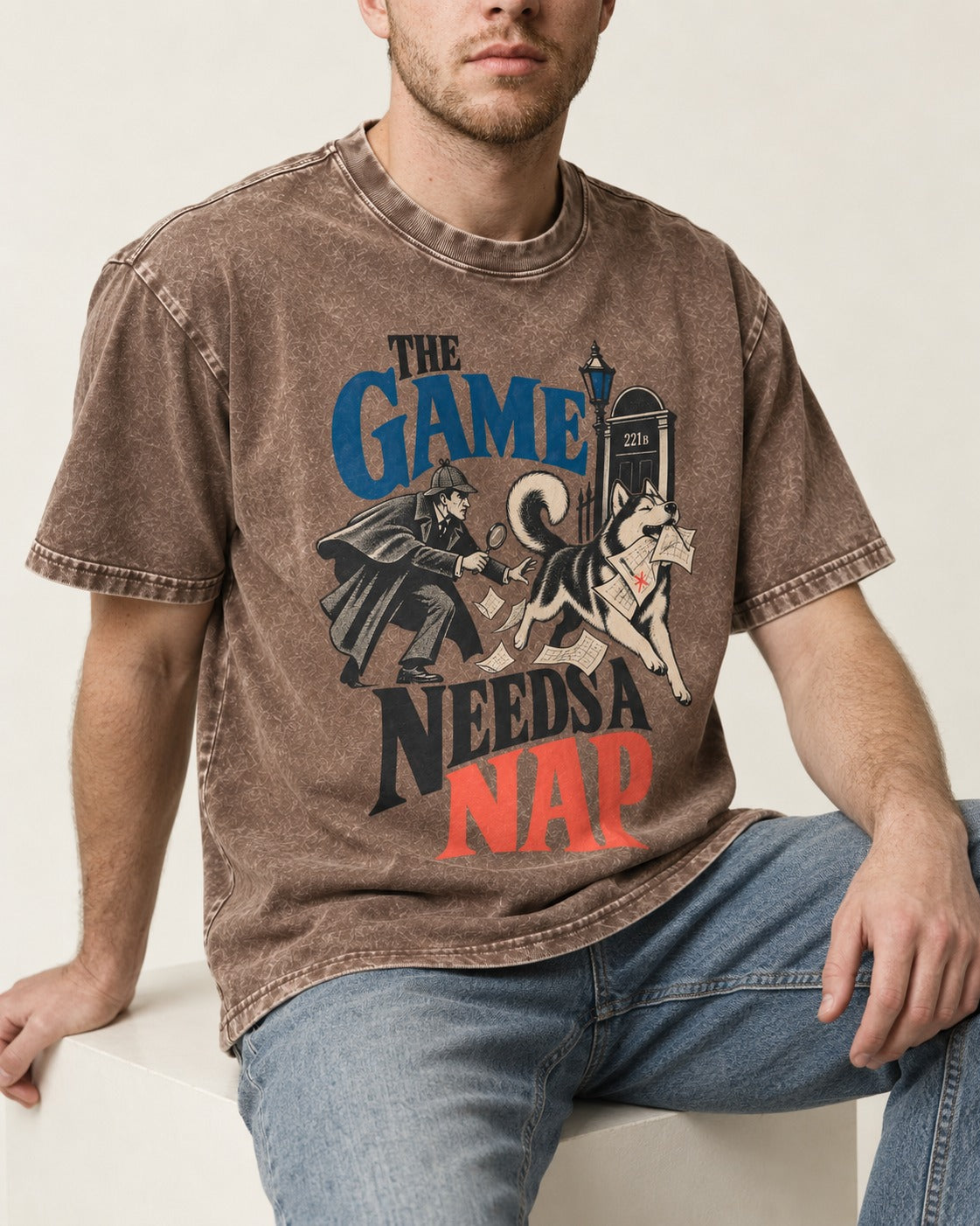 Husky Needs a Nap Washed Tee in Coffee, worn by a seated model