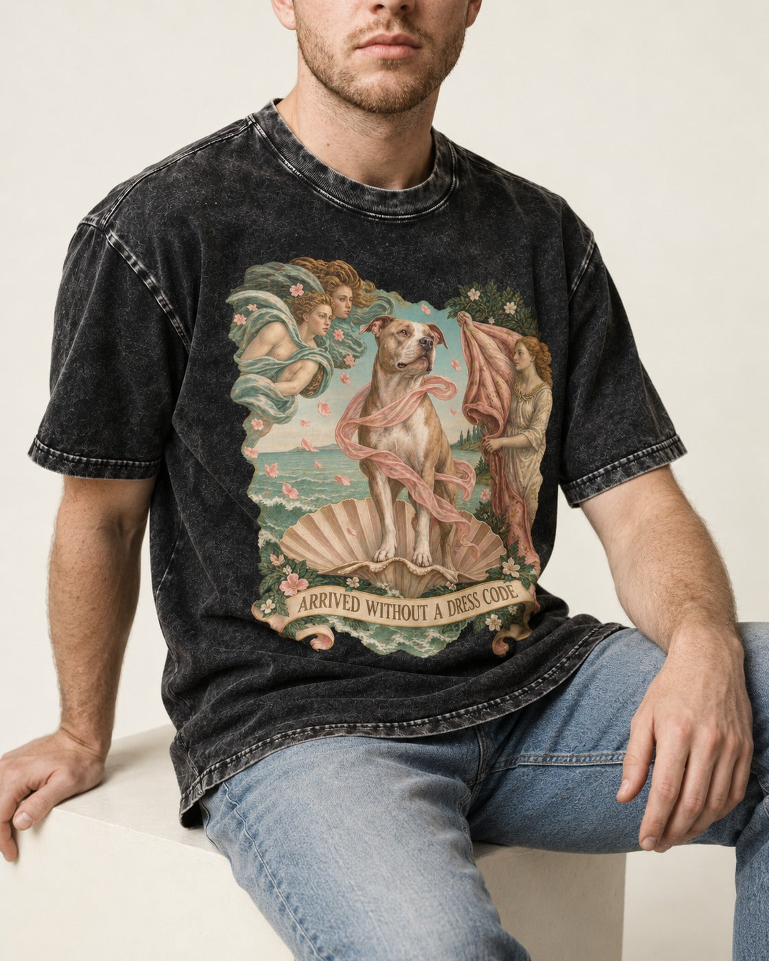 Pitbull Arrived Without a Dress Code Venus Parody Graphic Washed Tee in Black, worn by a seated model