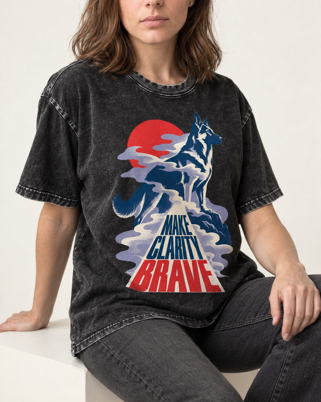 Make Clarity Brave Mountain German Shepherd Dog Graphic Washed Tee in Black, worn by a seated model