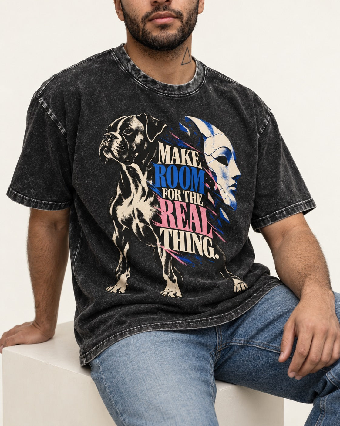 Make Room for the Real Thing Boxer Broken Mask Graphic Washed Tee in Black, worn by a seated model
