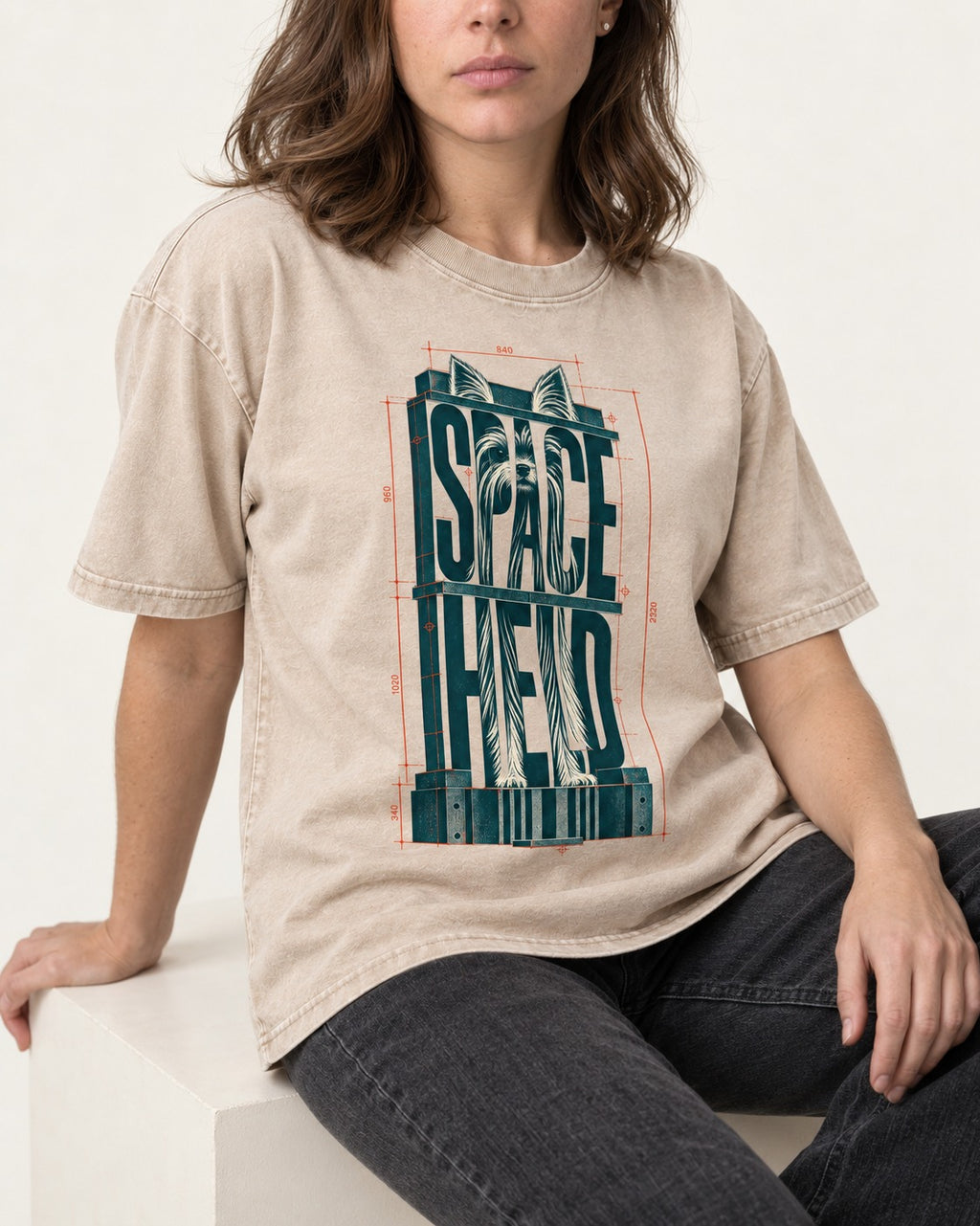 Yorkshire Terrier Space Head Washed Tee in Apricot, worn by a seated model