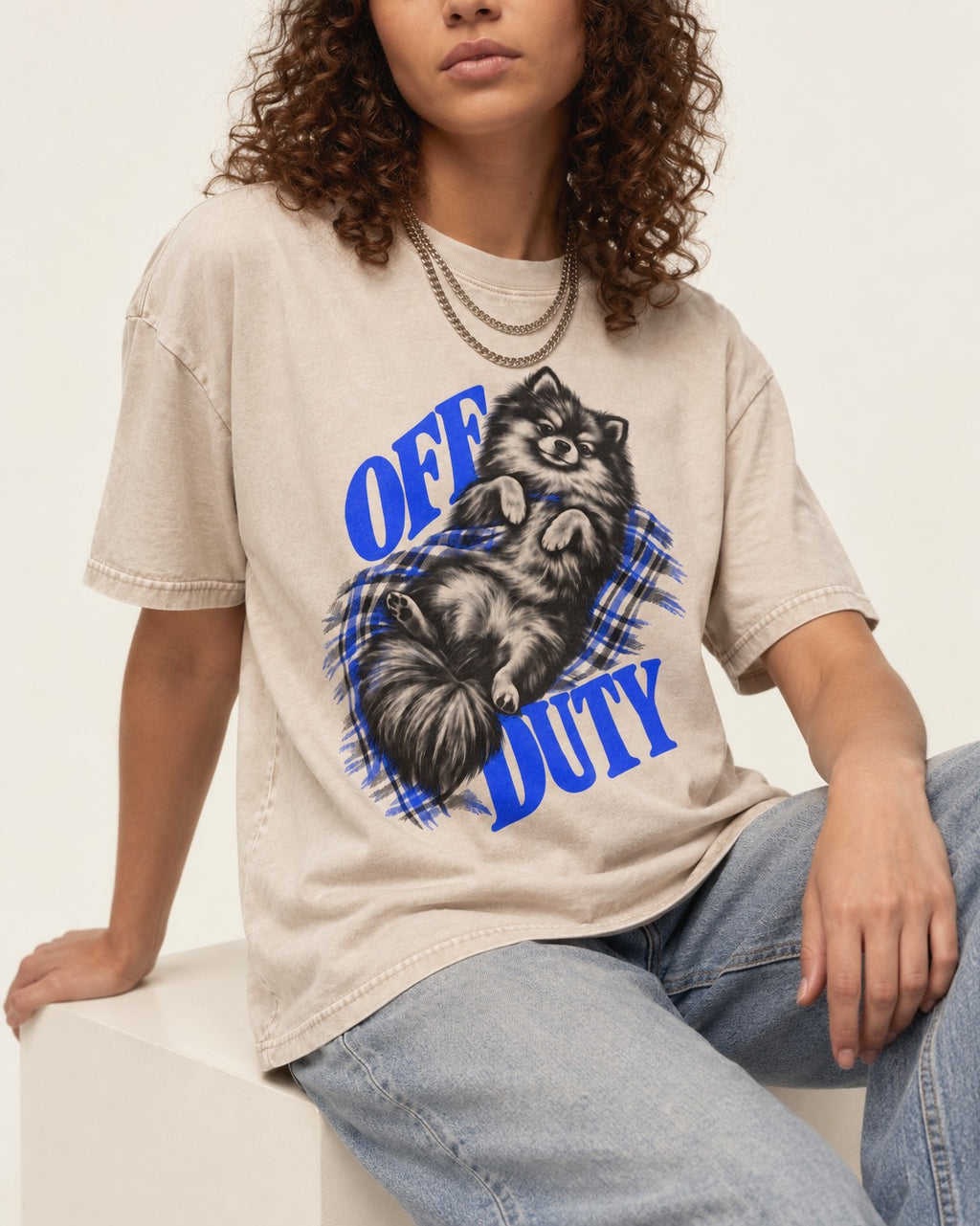 Off Duty Pomeranian Washed Tee in Apricot, worn by a seated model