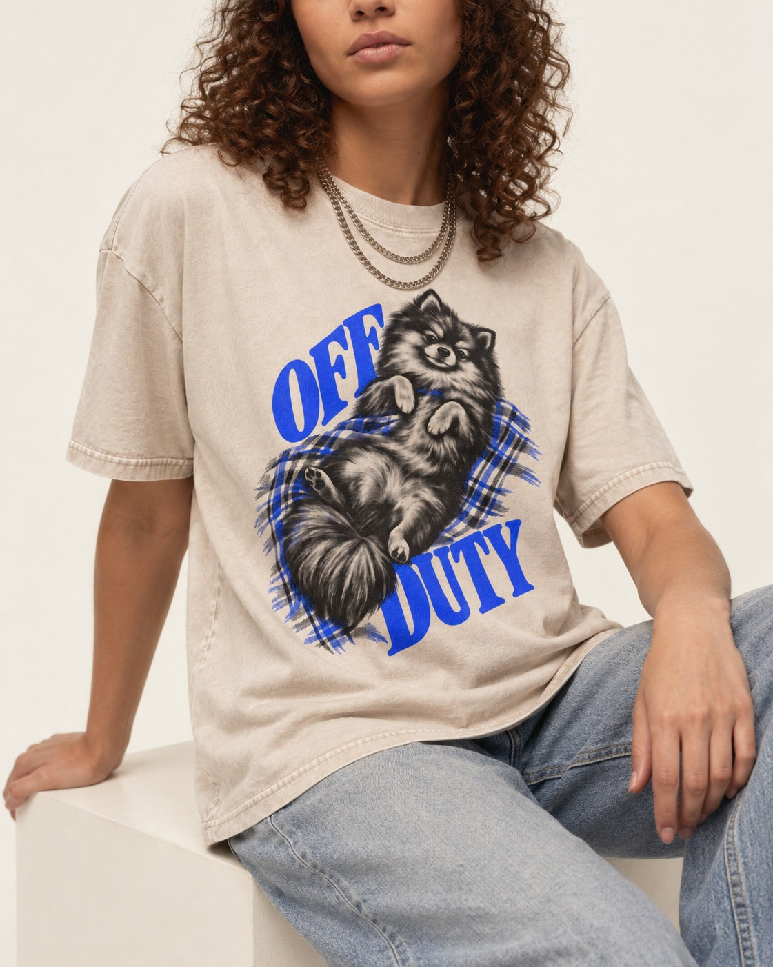 Off Duty Pomeranian Washed Tee in Apricot, worn by a seated model