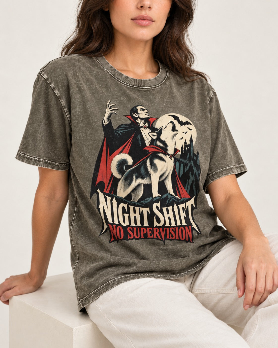 Husky Night Shift No Supervision Vampire Graphic Washed Tee in Army Green, worn by a seated model