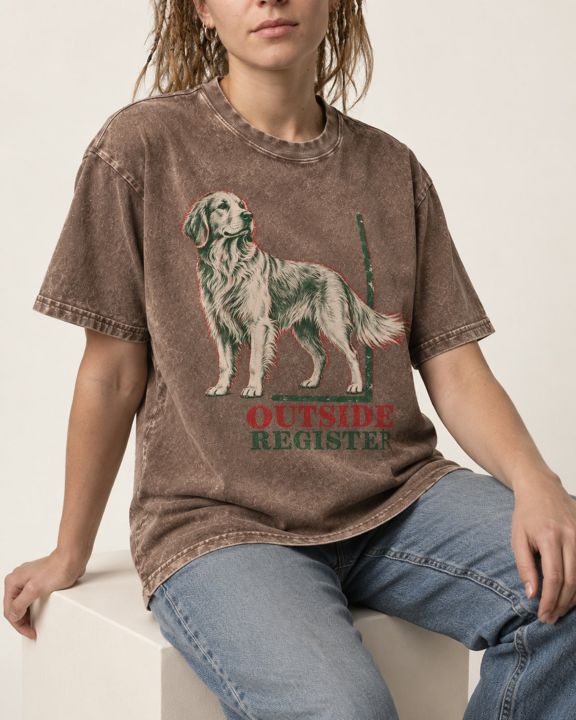 Outside Register Golden Retriever Washed Tee in Coffee, worn by a seated model