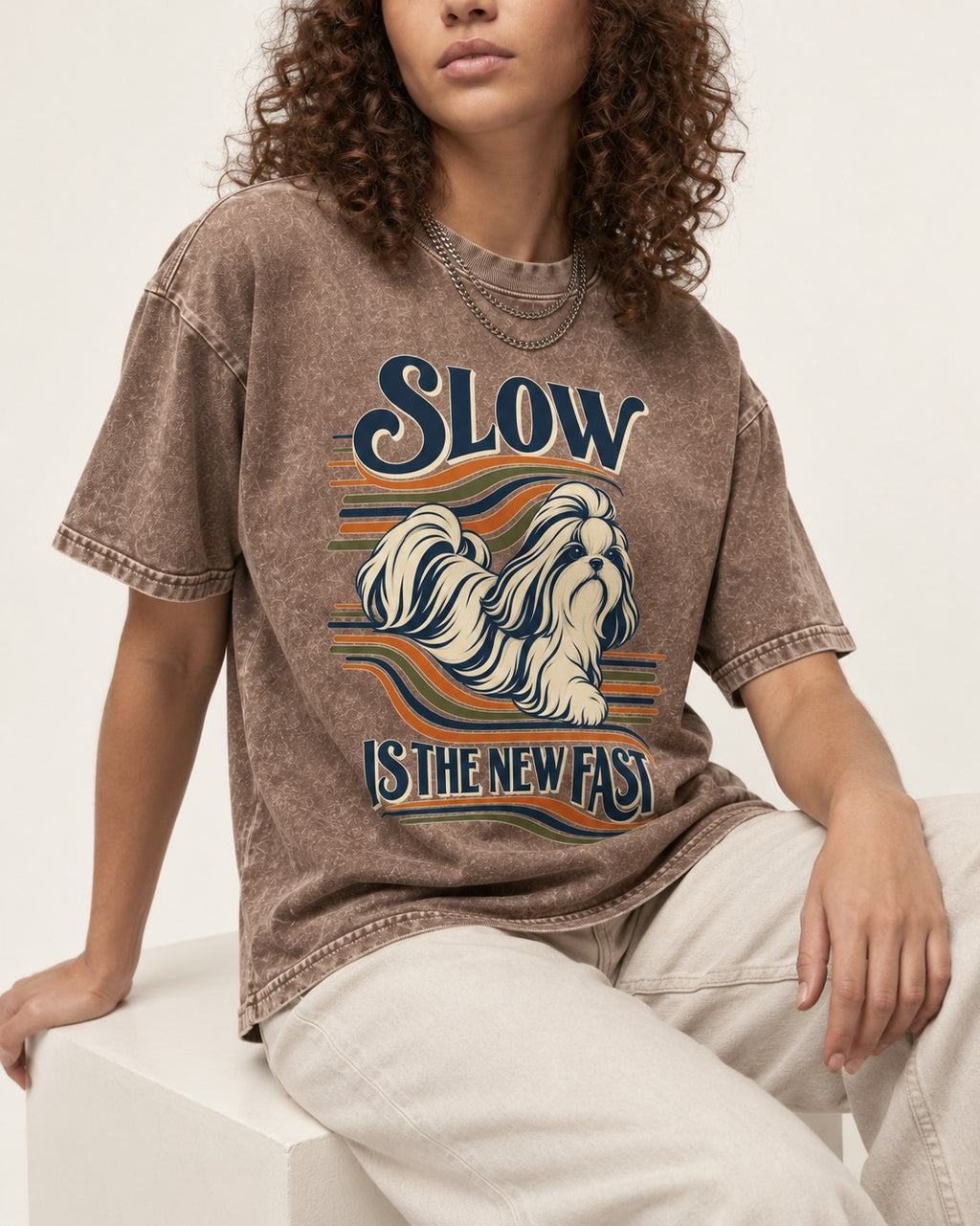 Slow Is Fast Shih Tzu Washed Tee in Coffee, worn by a seated model