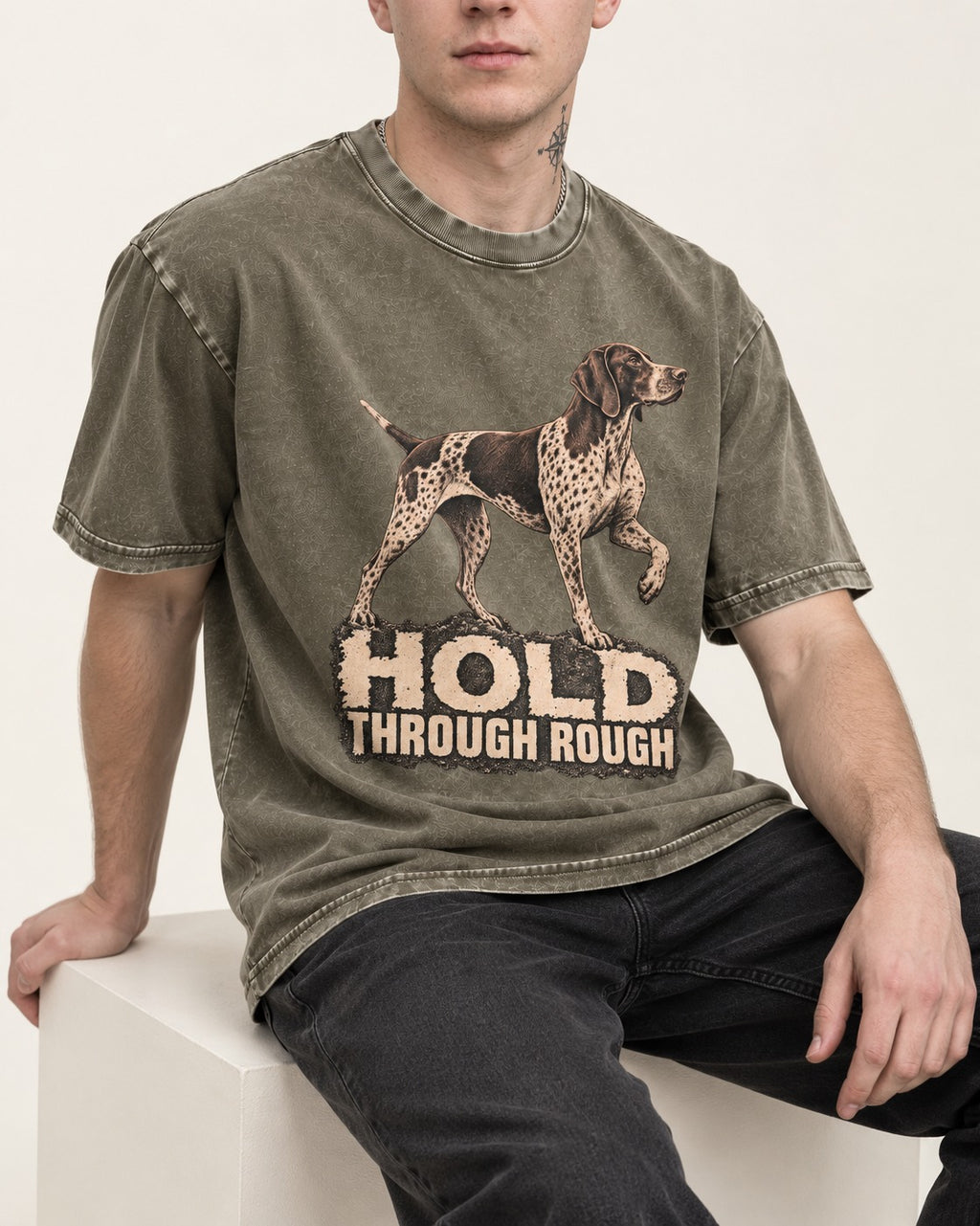German Shorthaired Pointer Hold Through Rough Vintage Graphic Washed Tee in Army Green, worn by a seated model