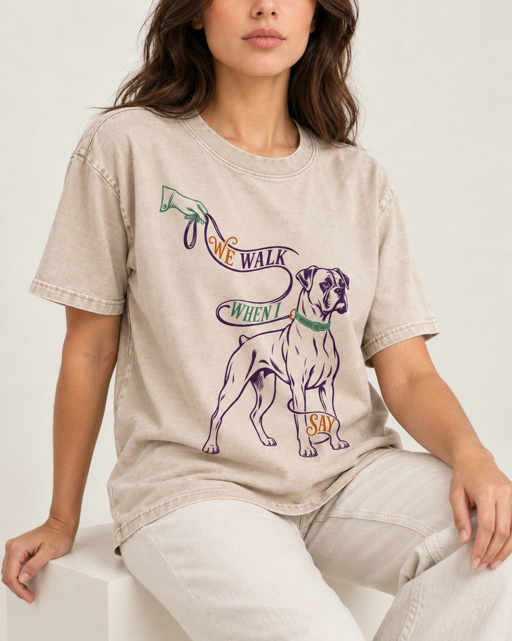 Boxer When I Say Washed Tee in Apricot, worn by a seated model