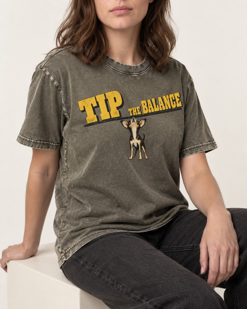 Chihuahua Tip the Balance Beam Graphic Washed Tee in Army Green, worn by a seated model