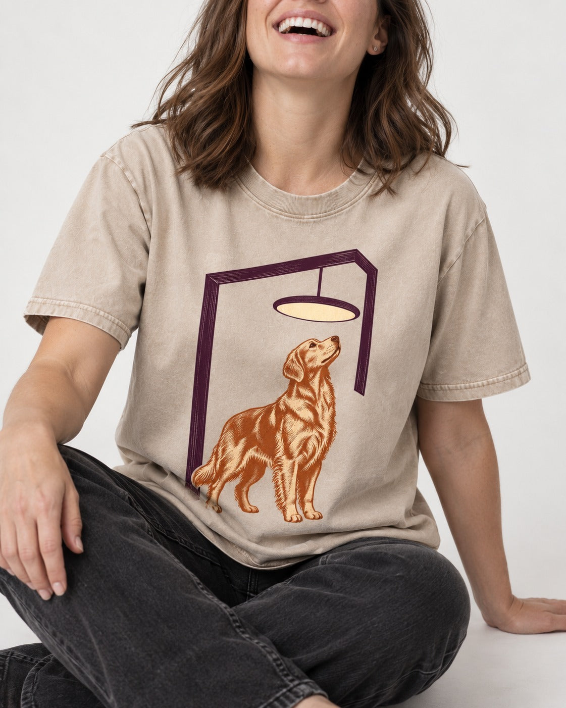Golden Retriever Bright Idea Washed Tee in Apricot, worn by a seated model