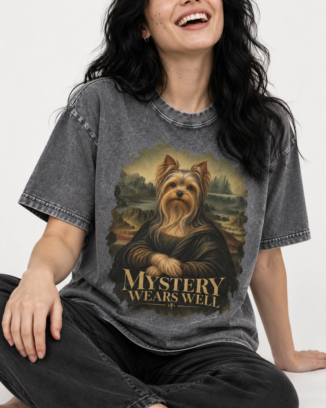 Yorkshire Terrier Mystery Wears Well Mona Lisa Portrait Graphic Washed Tee in Gray, worn by a seated model