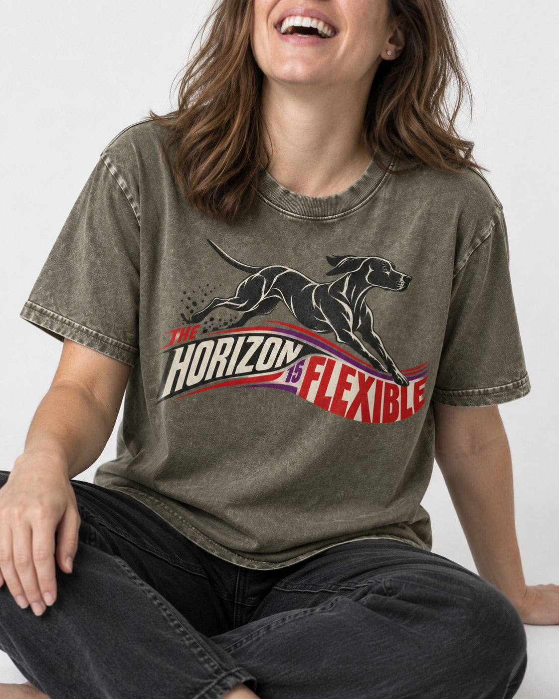 German Shorthaired Pointer The Horizon Is Flexible Racing Ribbon Graphic Washed Tee in Army Green, worn by a seated model