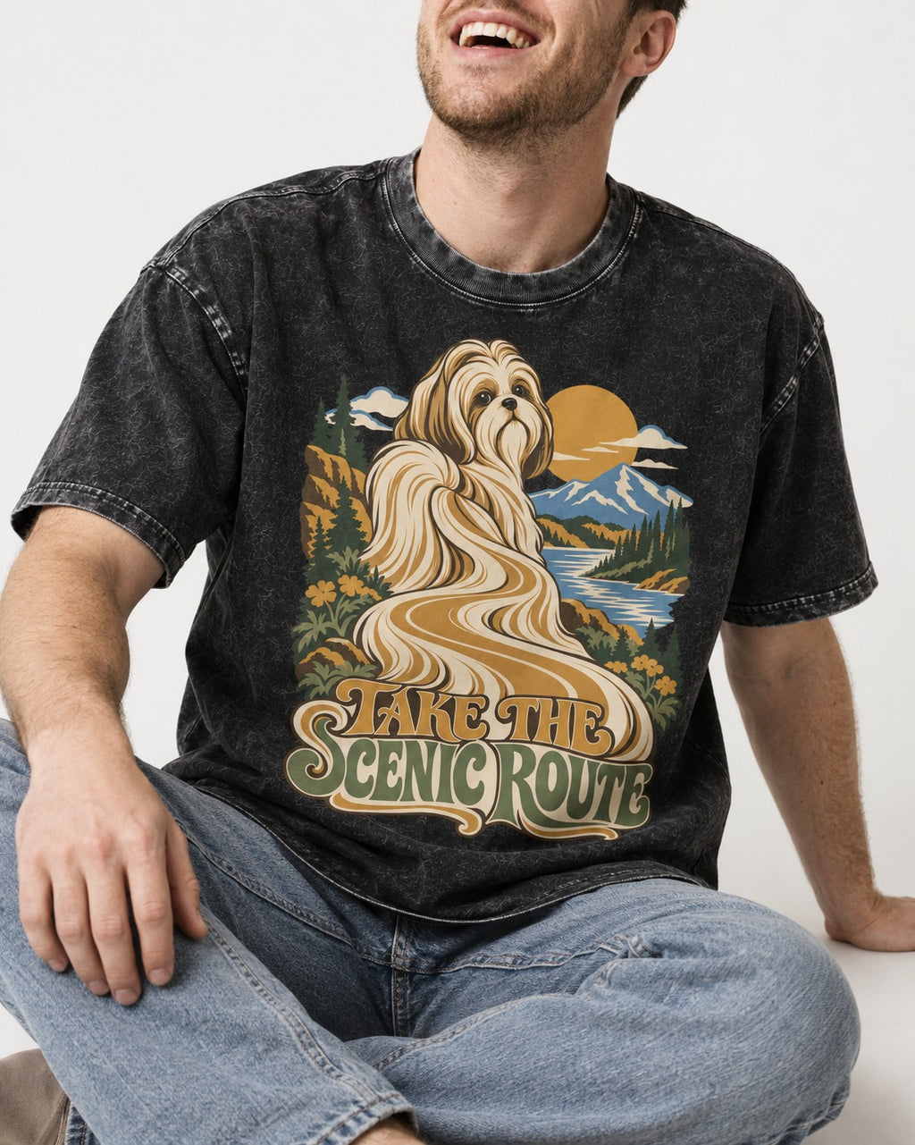 Shih Tzu Take the Scenic Route Mountain Vista Graphic Washed Tee in Black, worn by a seated model