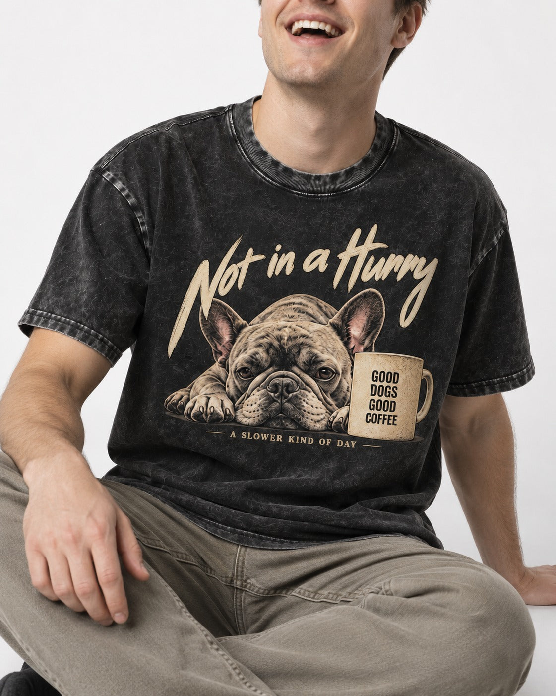 Frenchie Not in a Hurry Coffee Graphic Washed Tee in Black, worn by a seated model