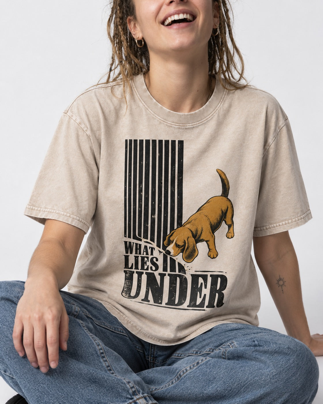 Beagle Knows What Lies Under Washed Tee in Apricot, worn by a seated model