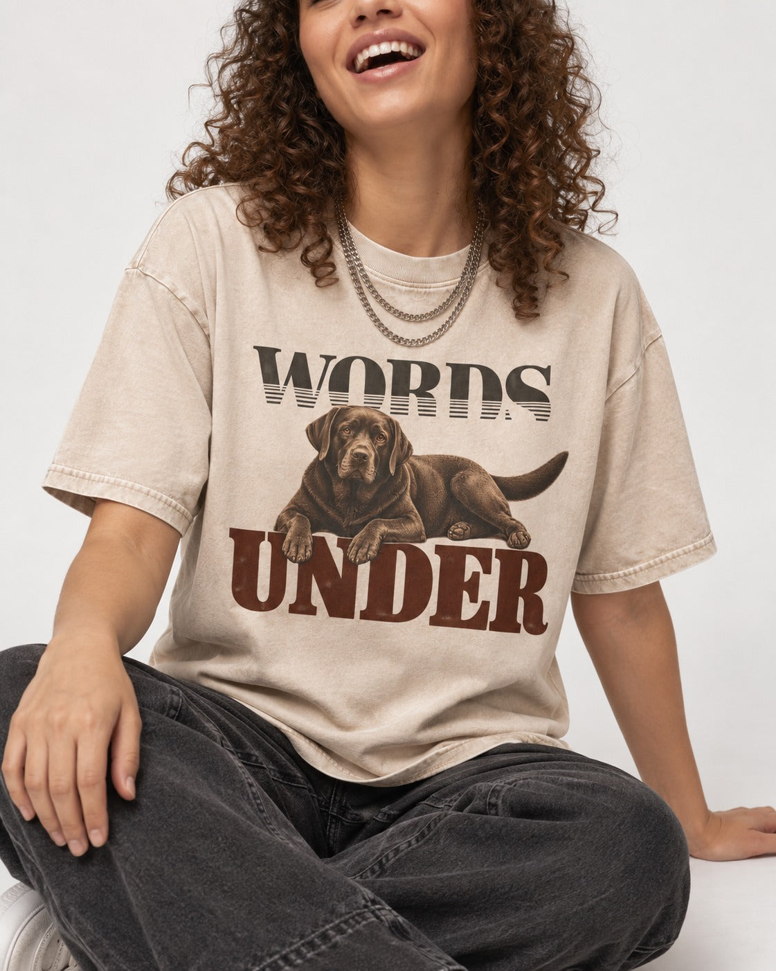 Words Under Labrador Retriever Washed Tee in Apricot, worn by a seated model