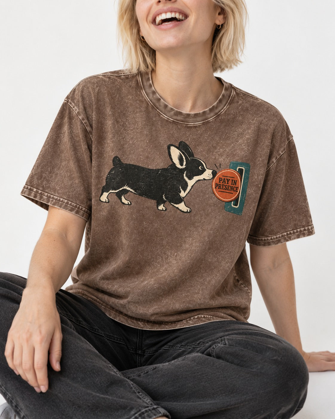 Corgi Pay in Presence Washed Tee in Coffee, worn by a seated model