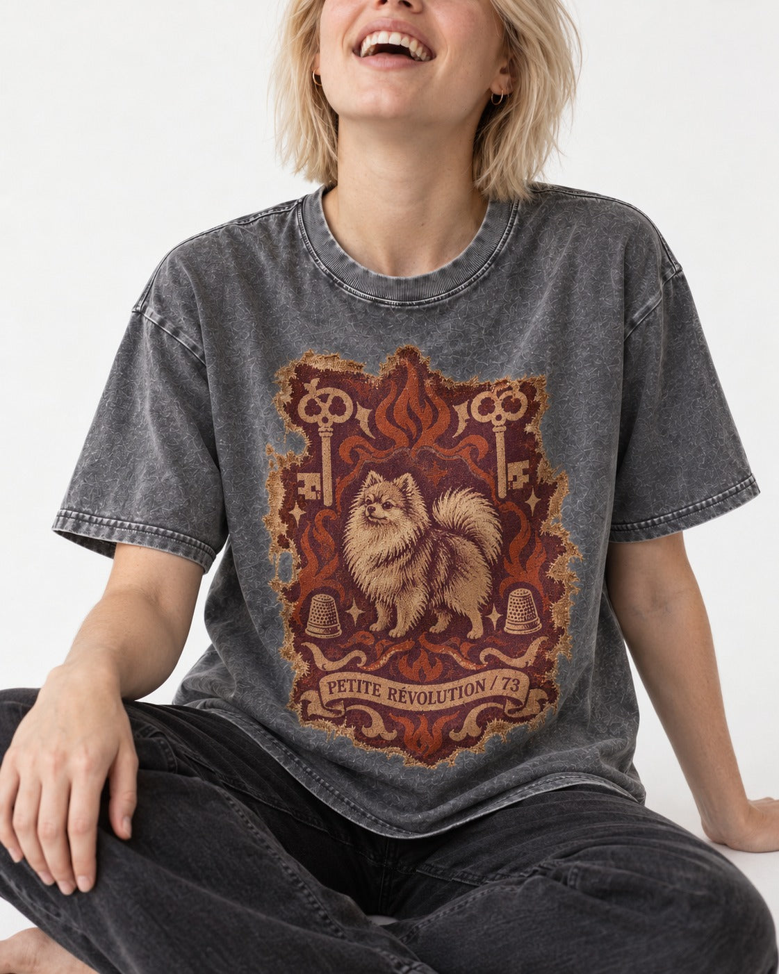 Pomeranian Petite Revolution Ornate Key Emblem Graphic Washed Tee in Gray, worn by a seated model