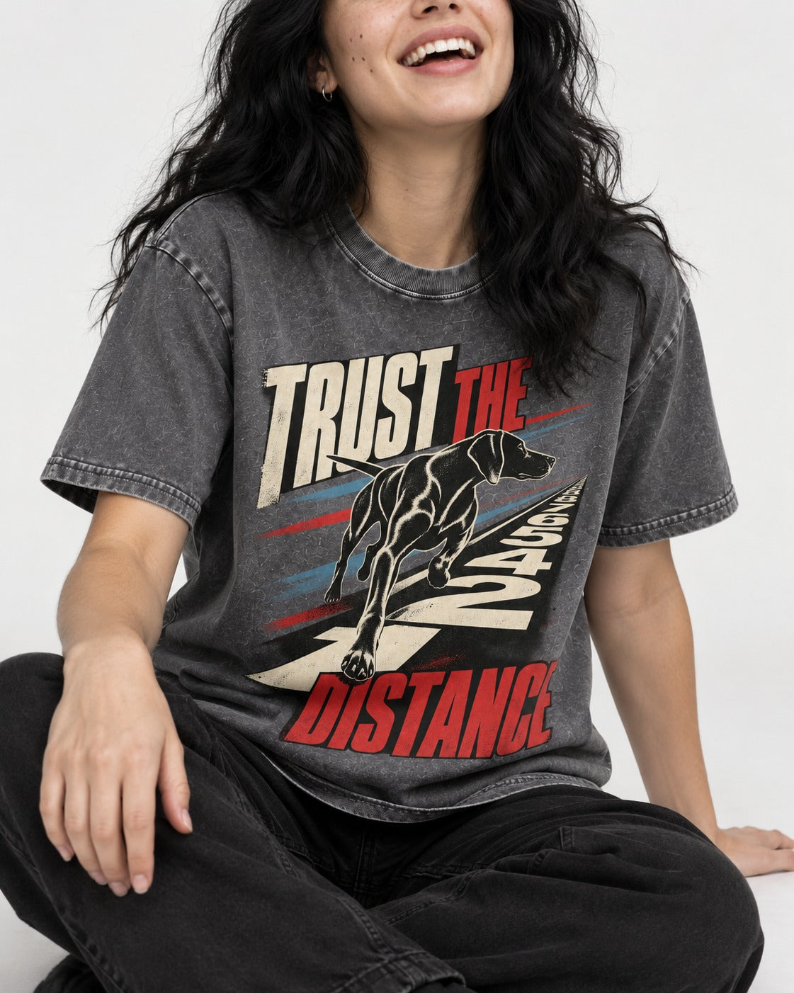 Trust the Distance German Shorthaired Pointer Graphic Washed Tee in Gray, worn by a seated model