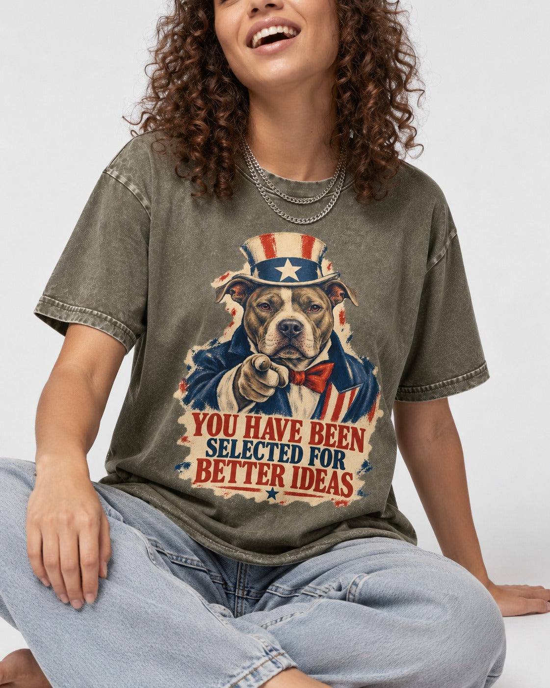 Pitbull You Have Been Selected for Better Ideas Uncle Sam Graphic Washed Tee in Army Green, worn by a seated model