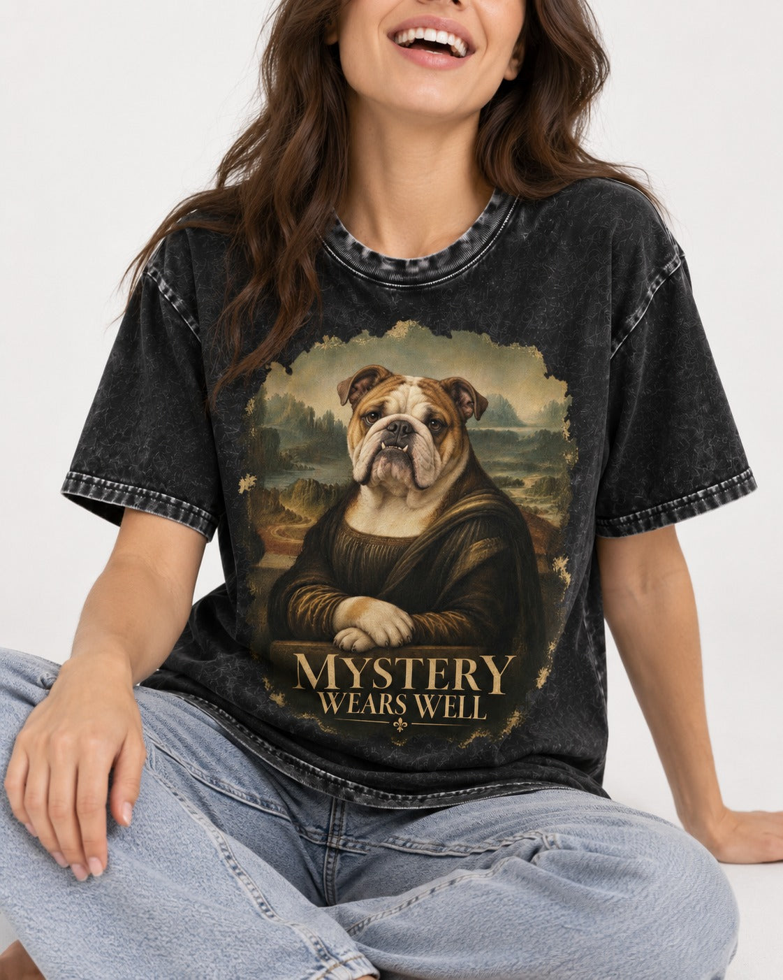 English Bulldog Mystery Wears Well Mona Lisa Portrait Washed Tee in Black, worn by a seated model