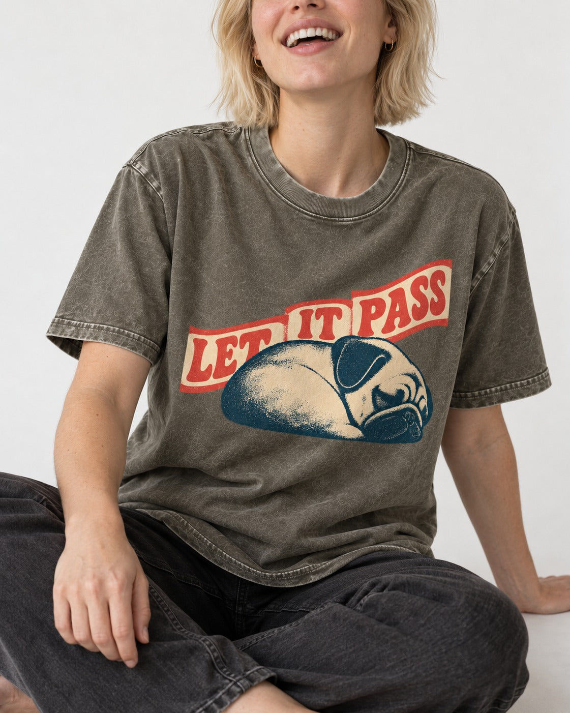 Pug Let It Pass Sleeping Banner Graphic Washed Tee in Army Green, worn by a seated model